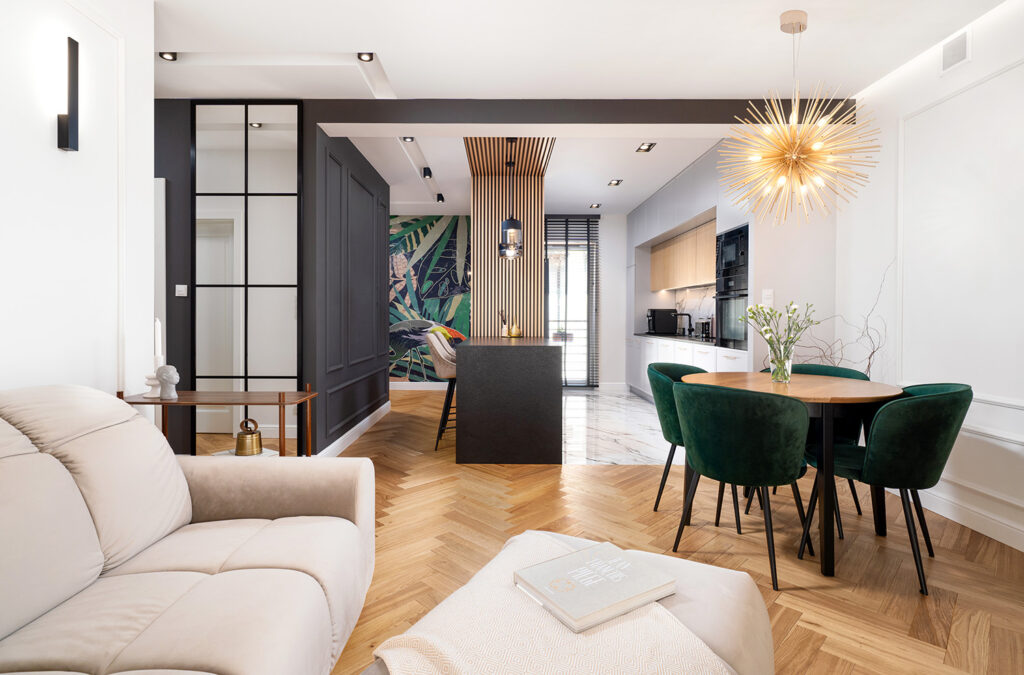 Nowoczesny salon z otwartą kuchnią — stylowe wnętrze idealne na wynajem
